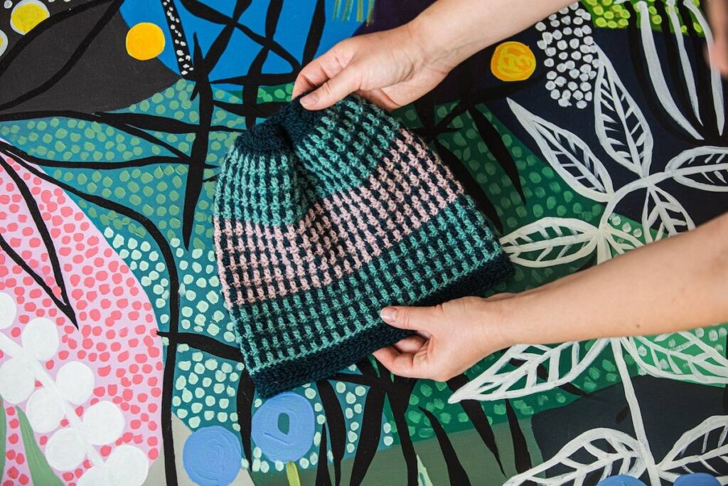 Black, turquoise and pink crocheted hat by Kate Veselunka