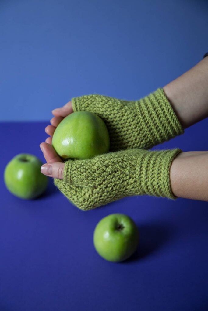 Apple green crocheted fingerless gloves by Kate Veselunka