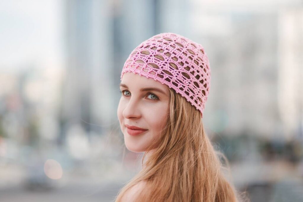 Pink crocheted hat by Kate Veselunka