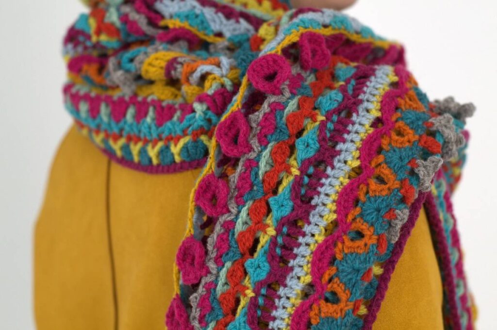 Colorful crocheted shawl by Kate Veselunka
