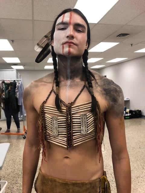 Young man in a costume made by Kristine Berg
