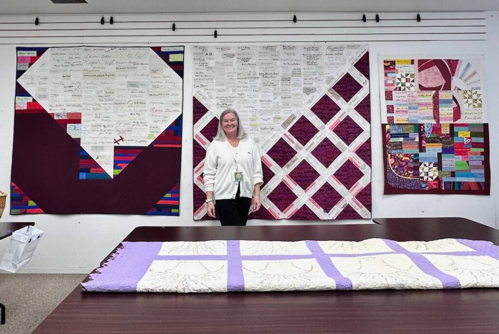 Tina Davis and several of her quilts