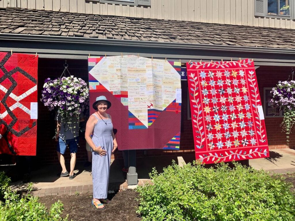 Tina and Salvaged Signatures I at the Sisters Outdoor Quilt Show