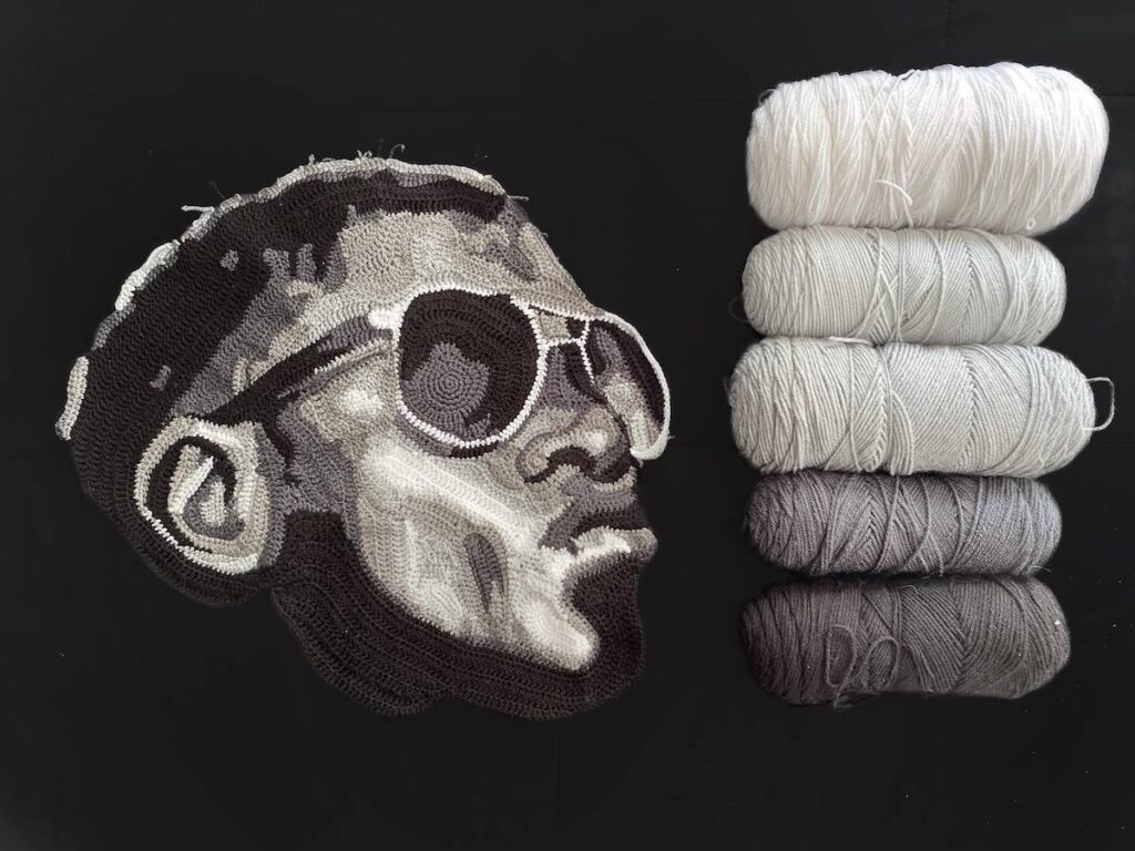 Black man crocheted in gray tones by Will Chatlosh
