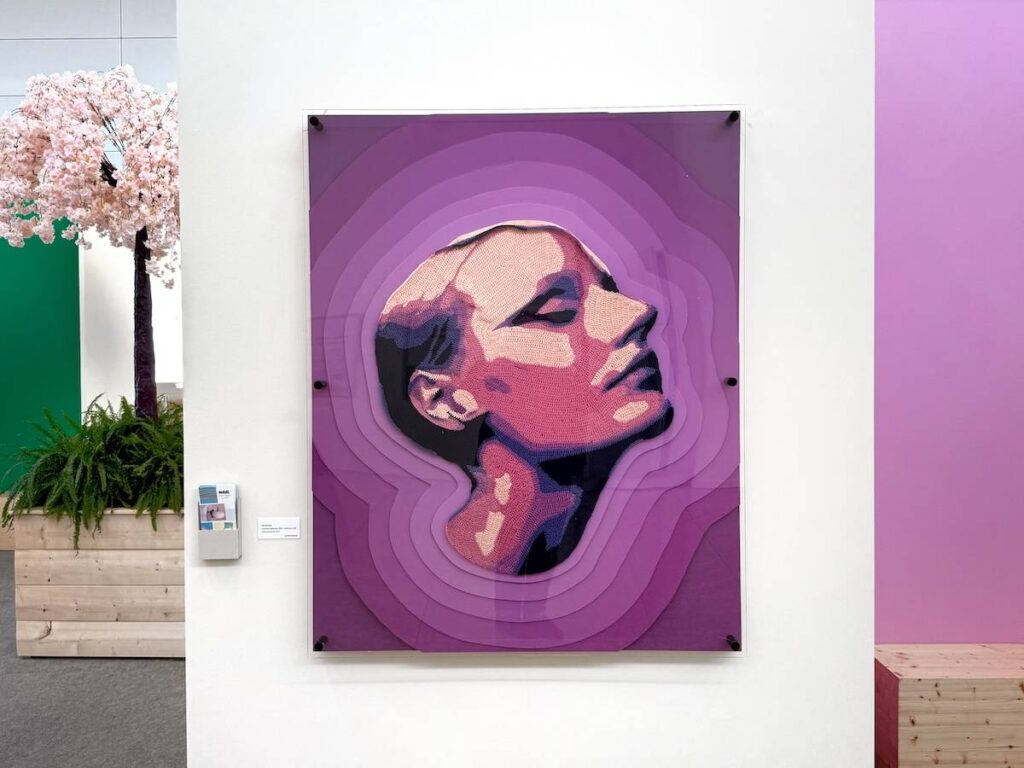 A woman's face crocheted in purples by Will Chatlosh