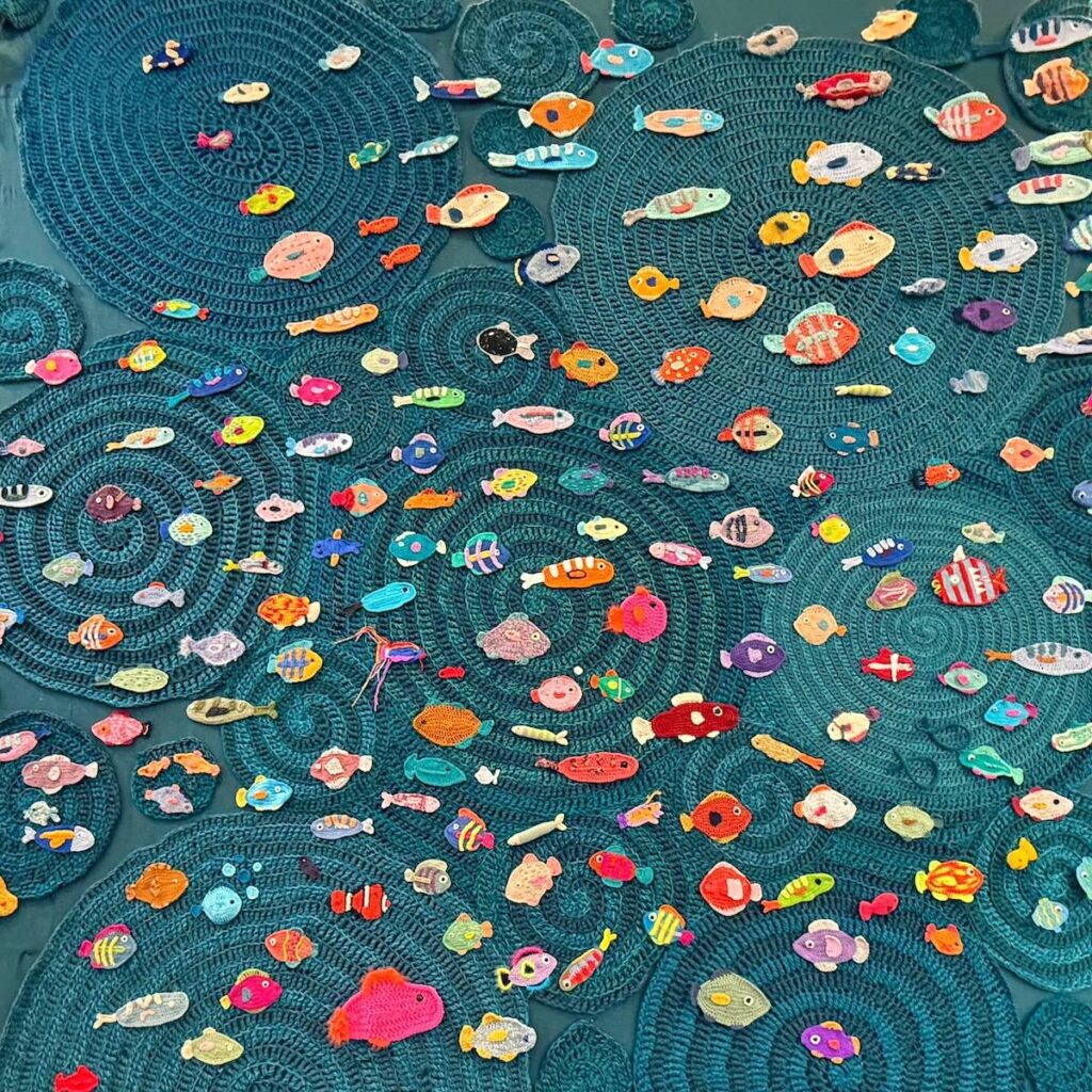 Details of sea of crocheted fish by Will Chatlosh