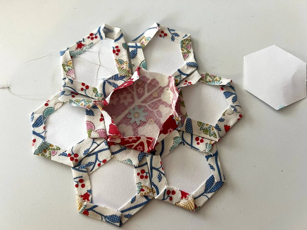 EPP take paper out of center to then sew the flower petals