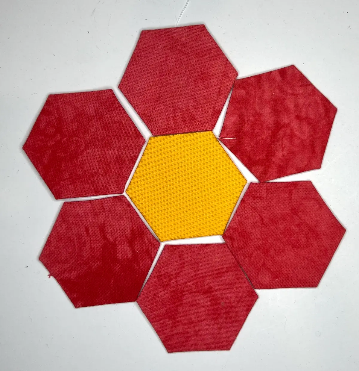Hexie flower pincushion hexies laid out