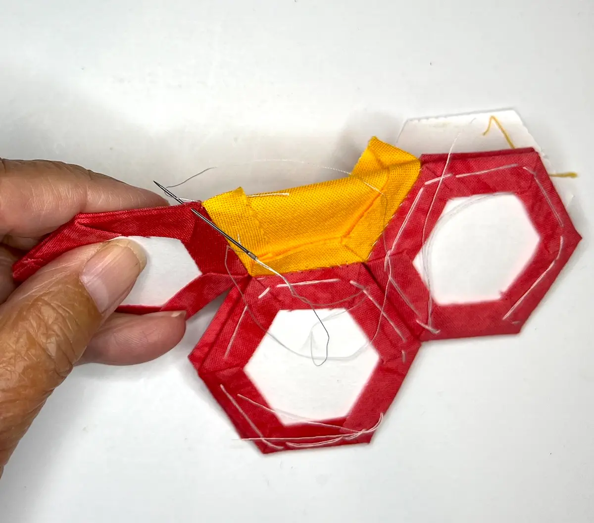 Hexie flower pincushion now sew the petals together