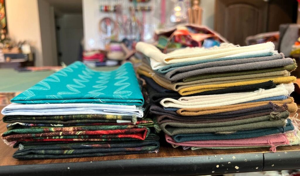 Fabric storage organization showing two piles of folded fabric