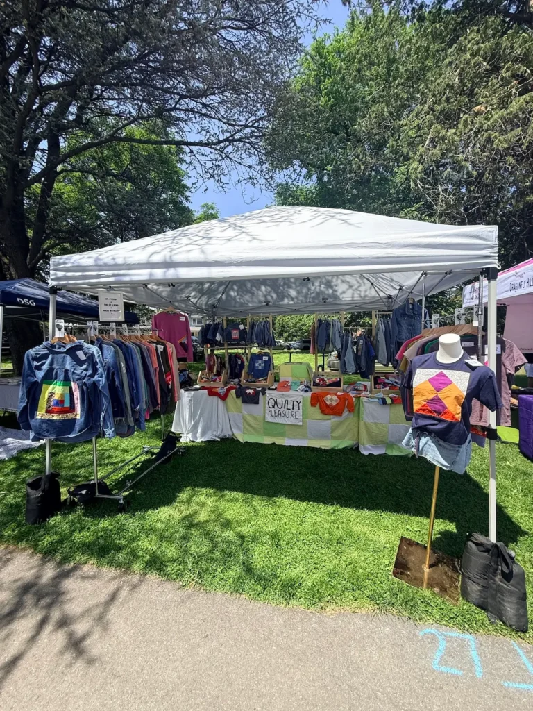 An outdoor craft show with Amanda Milz garments