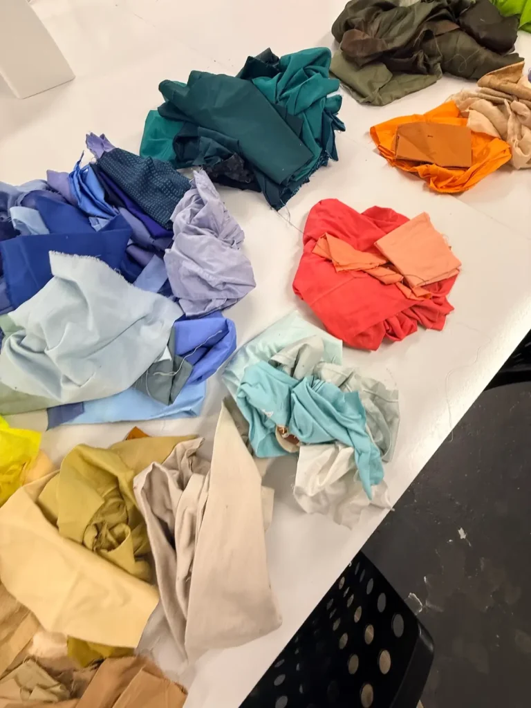 Showing piles of fabric ready for an art quilt by Amanda Milz