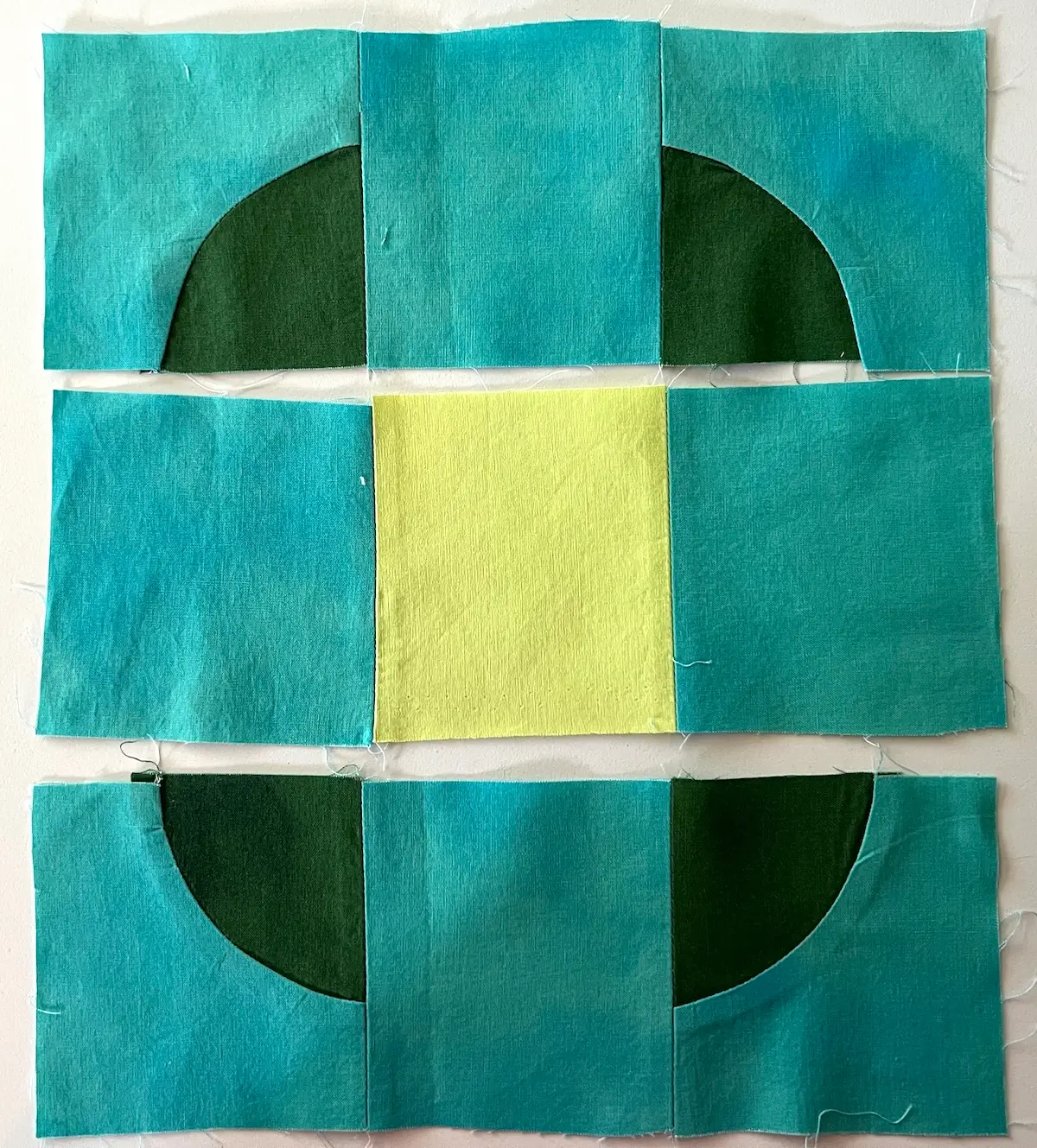 Rows sewn together for the button quilt block