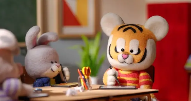 Tiger at the table workin gin a classroom by Chelsea Trousdale