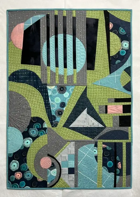 Modern quilt in green and teal made by Deborah Csongradi