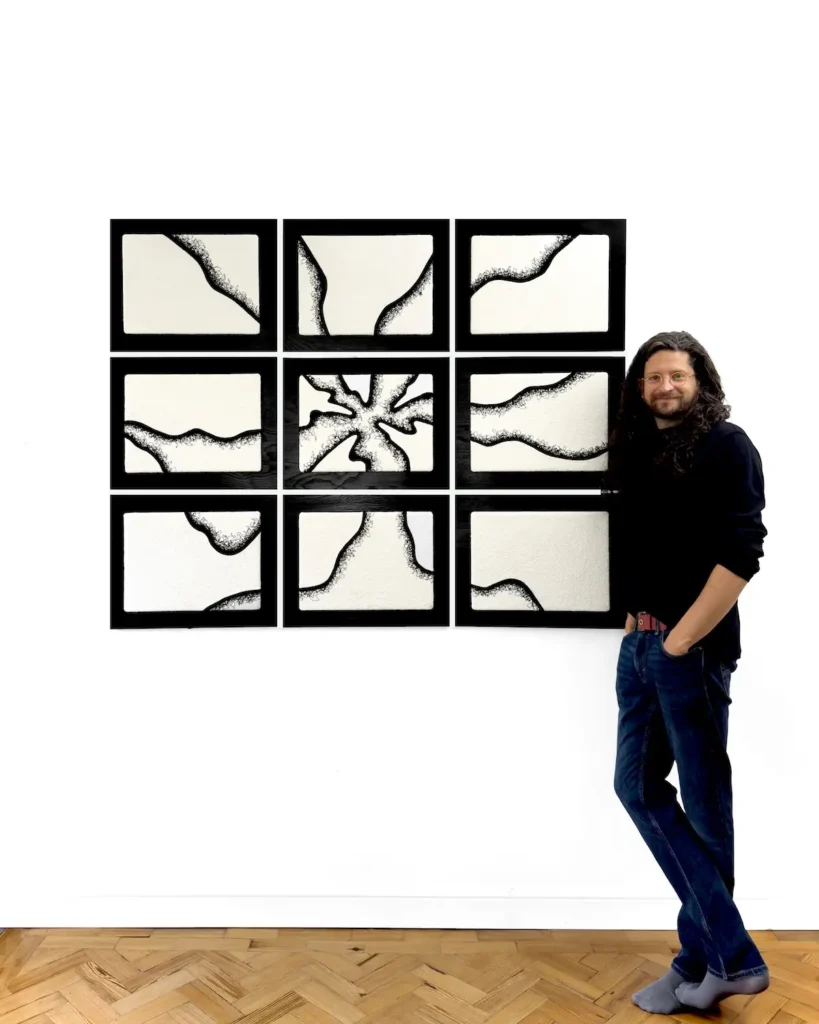 Dr. Jack Roberts and an artwork on display July 2026