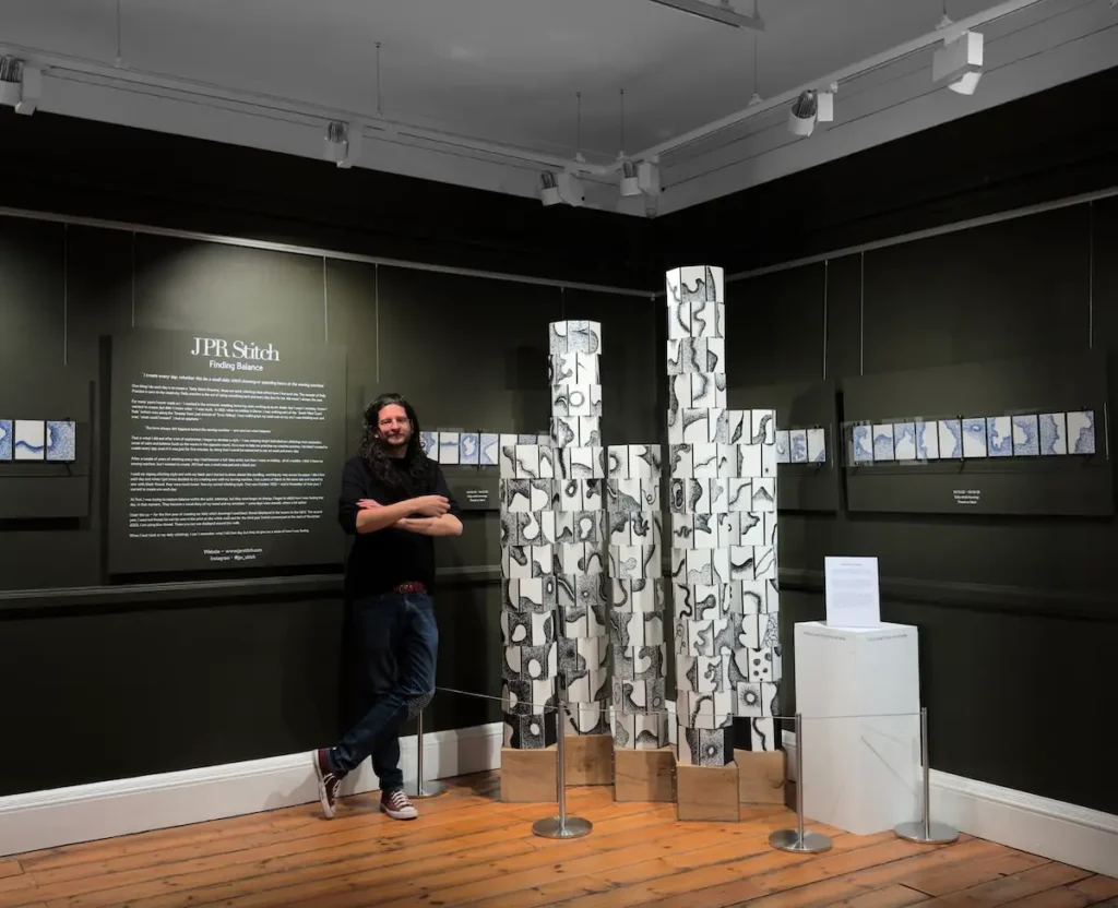 Dr. Jack Roberts and some of his 'Daily Stitch Drawings'