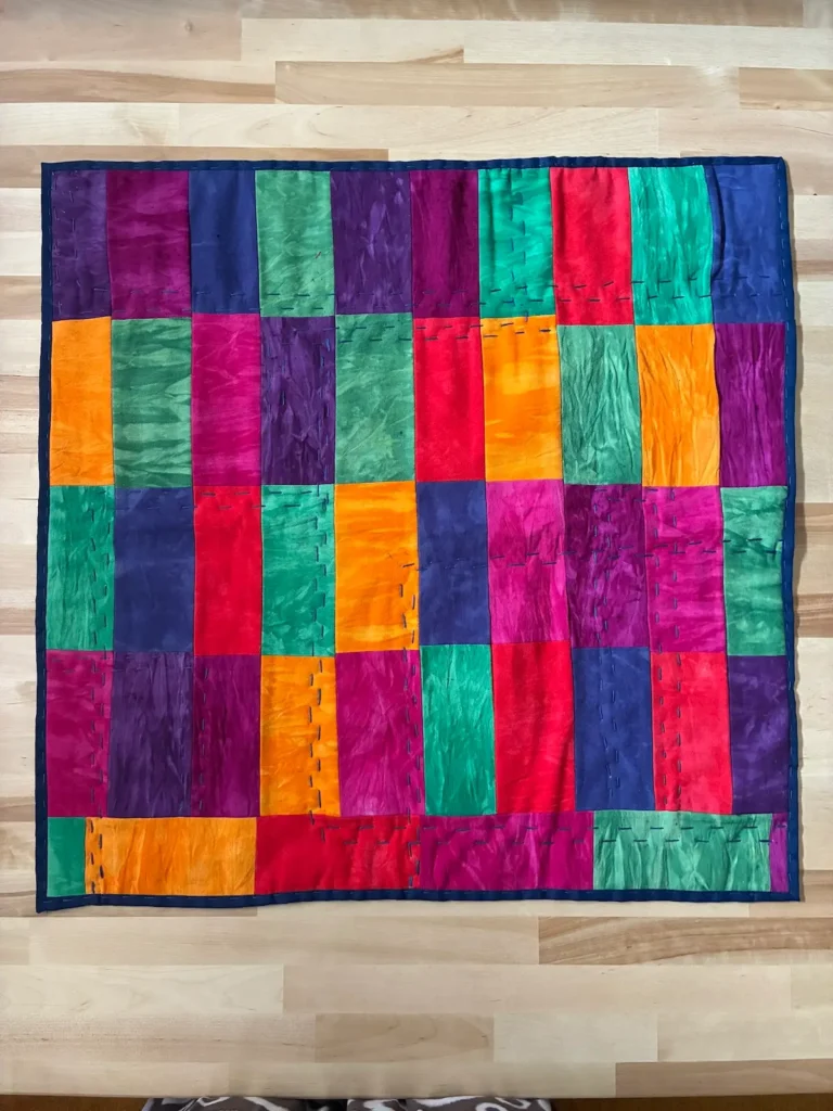 Small color block quilt by Dr. Jaleesa Wells