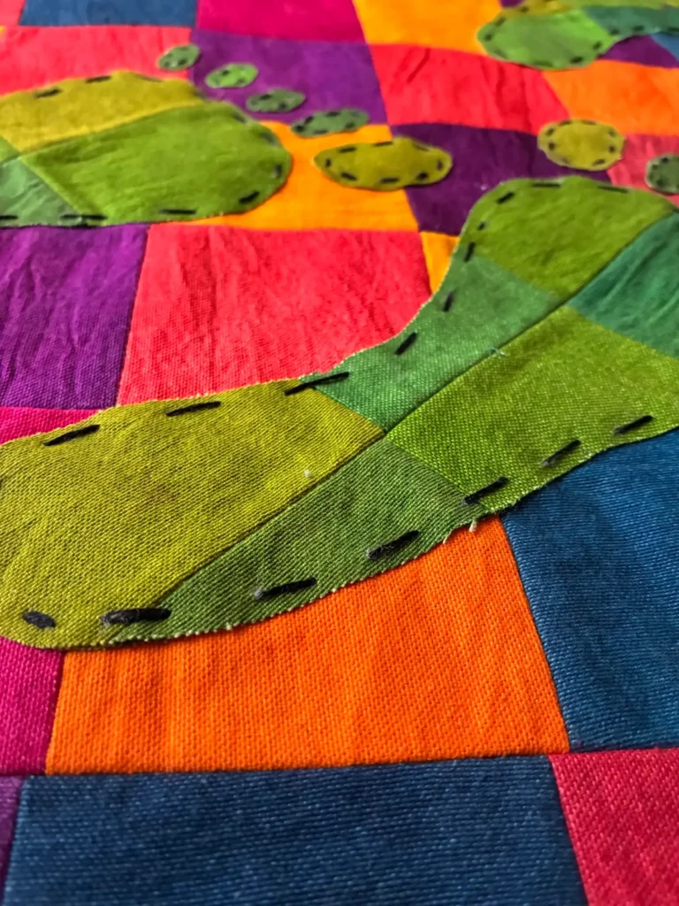 Detail of stitching on a quilt by Dr. Jaleesa Wells