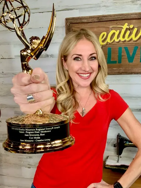 Janet Clauss with Emmy for her Creative Living show