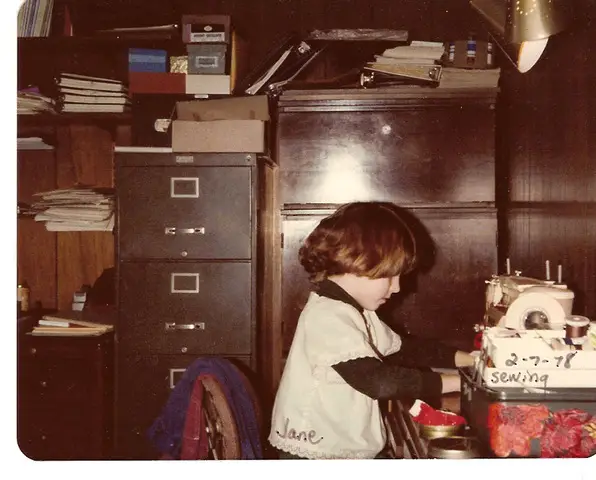 Jane Claus at 7 sewing