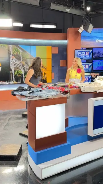 Jane Clauss showing a TV host how to do a project