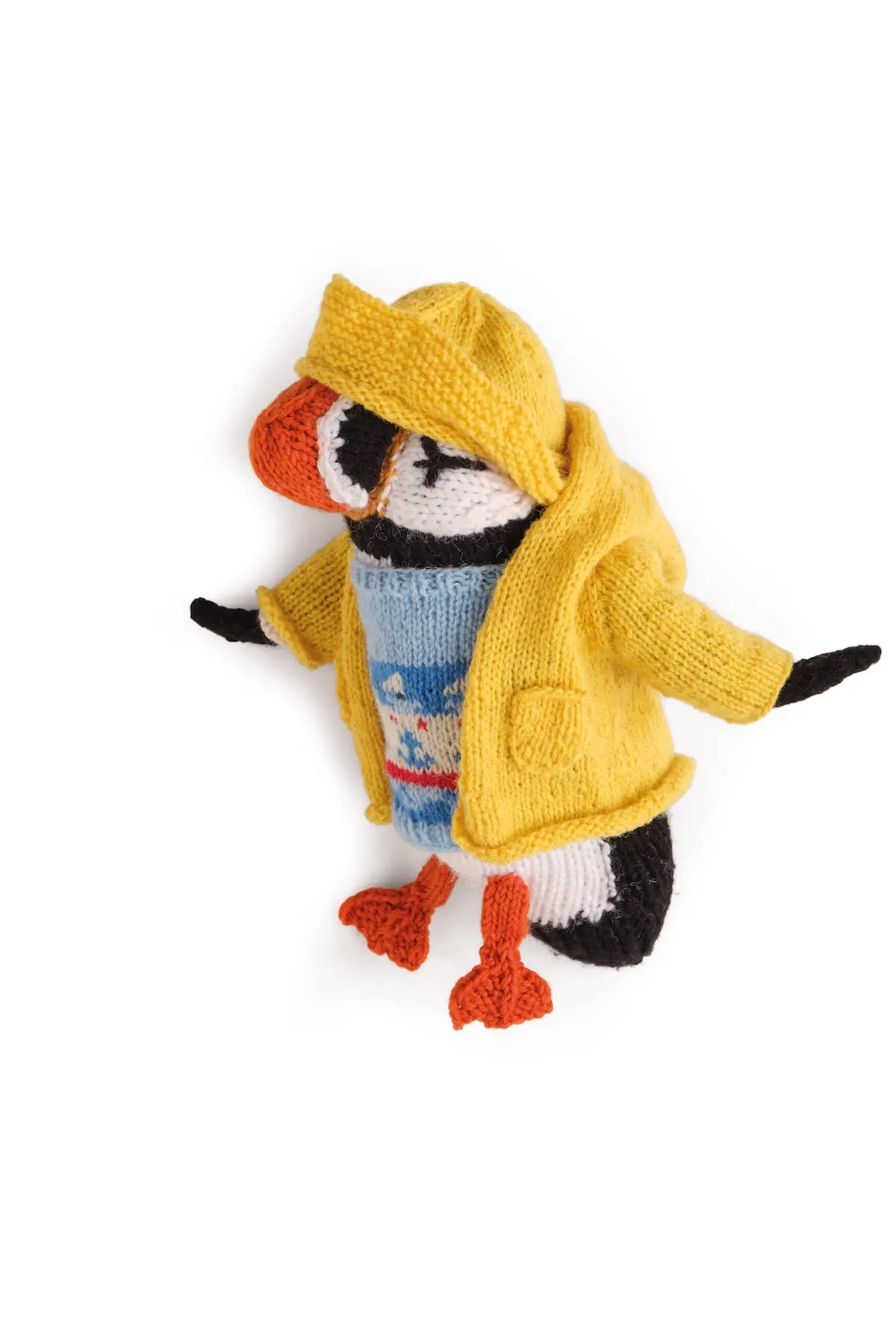 Knitted penguin with sweater, rain slicker and hat by Karla Courtney