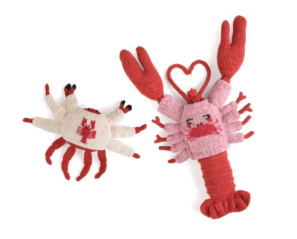 Knitted crab and lobster both with custom knitted sweaters by Karla Courtney