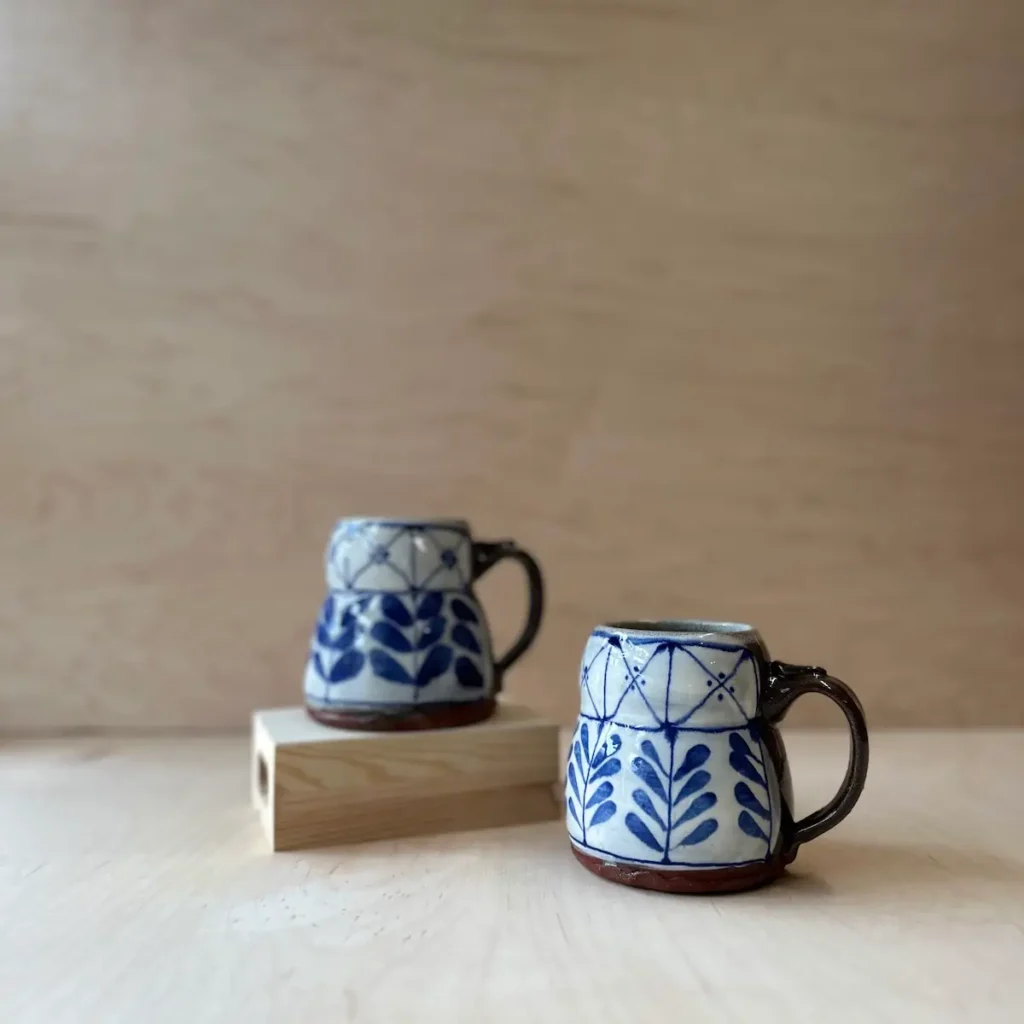 Two pottery coffee cups made by Summer Brendlinger