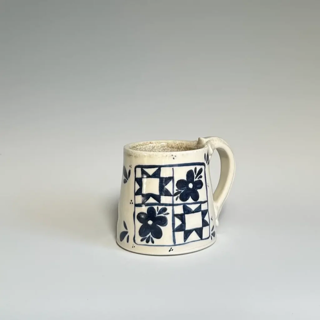 Quilt-like design on a pottery mug made by Summer Brendlinger