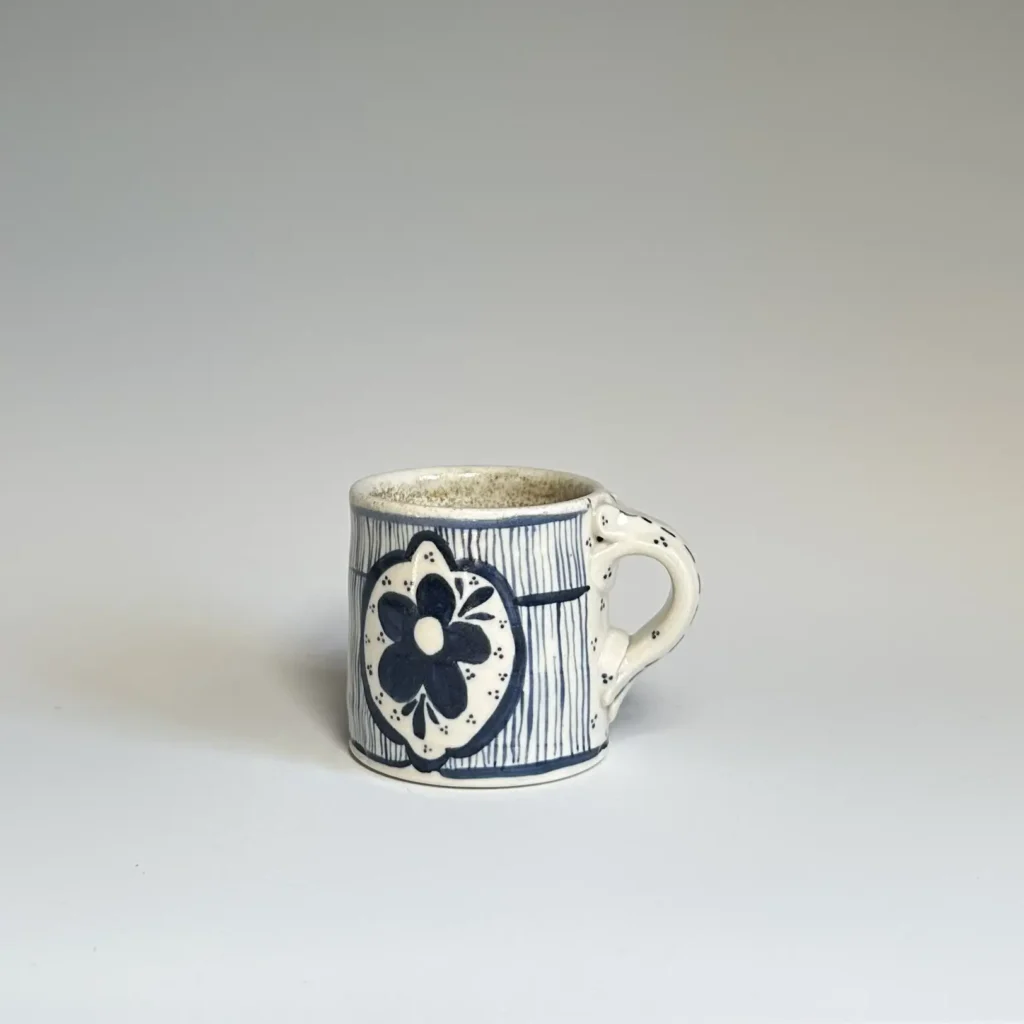 Big flower on a pottery mug made by Summer Brendlinger