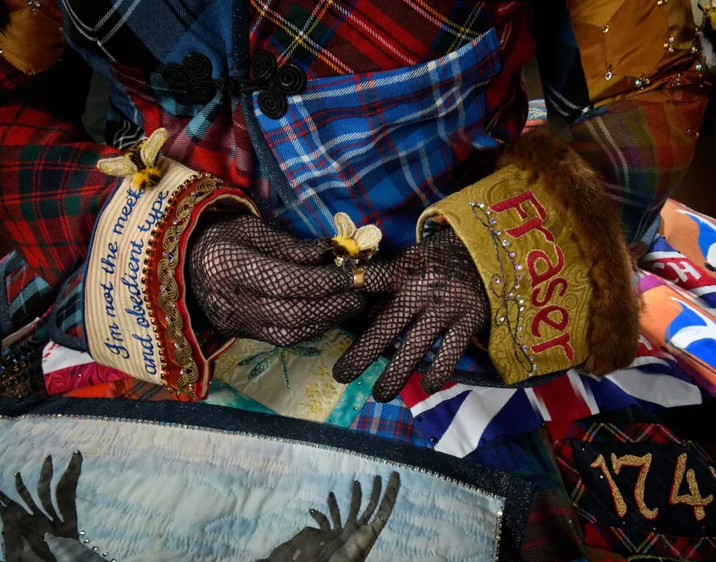 Close up of gloves and cuffs on patchwork dress by Teri Biglands