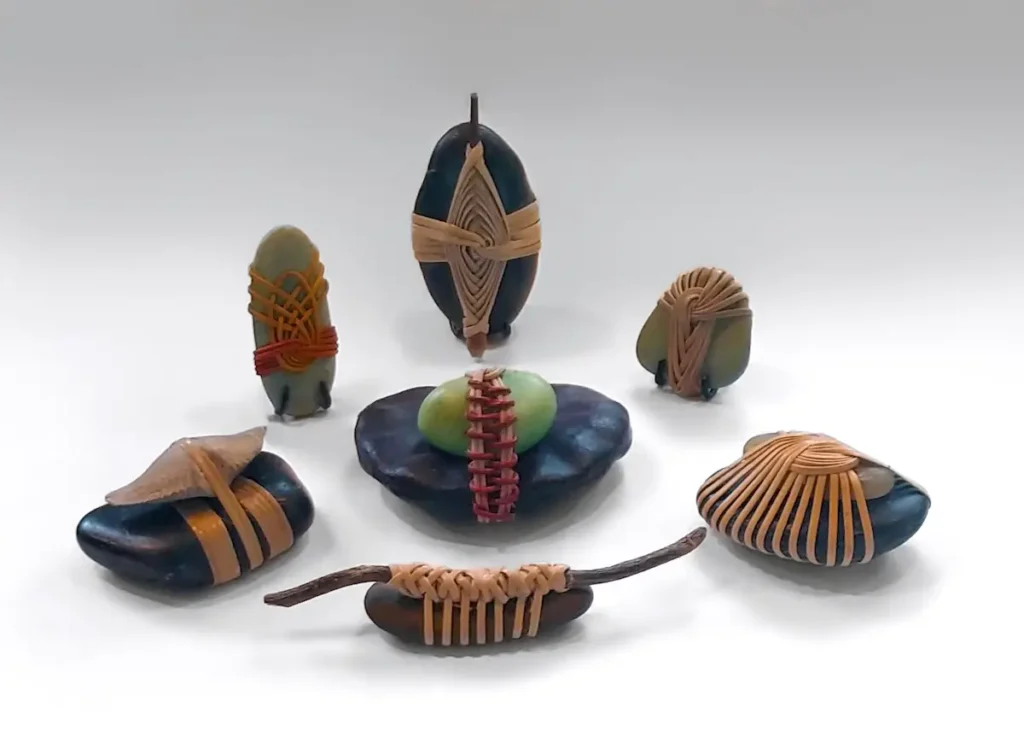 Stones under 2 inches woven art by Bonnie Kuhr