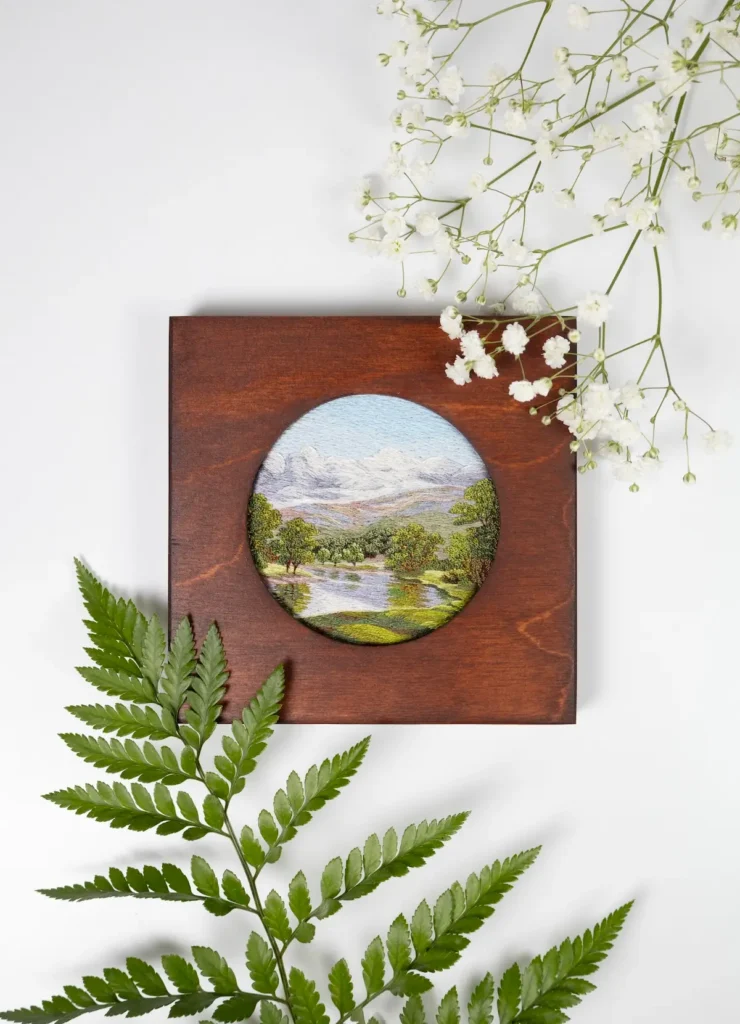 River and mountain embroidery art by Cassandra Dias