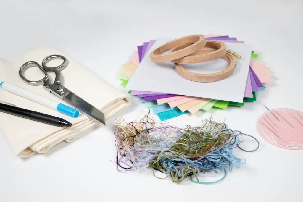 Showing the supplies needed to make embroidery art by Cassandra Dias
