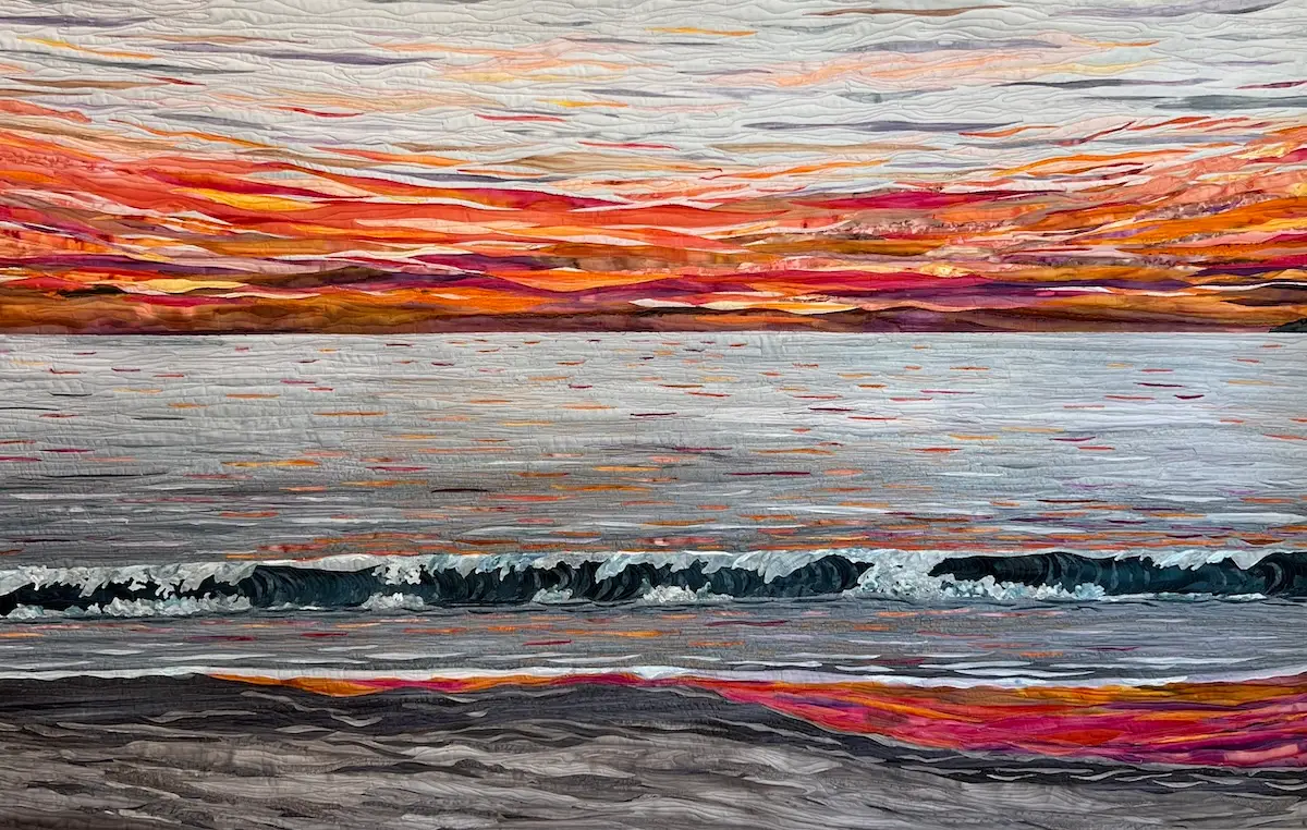 Sunset over the ocean fabric art by Cynthia Minoli