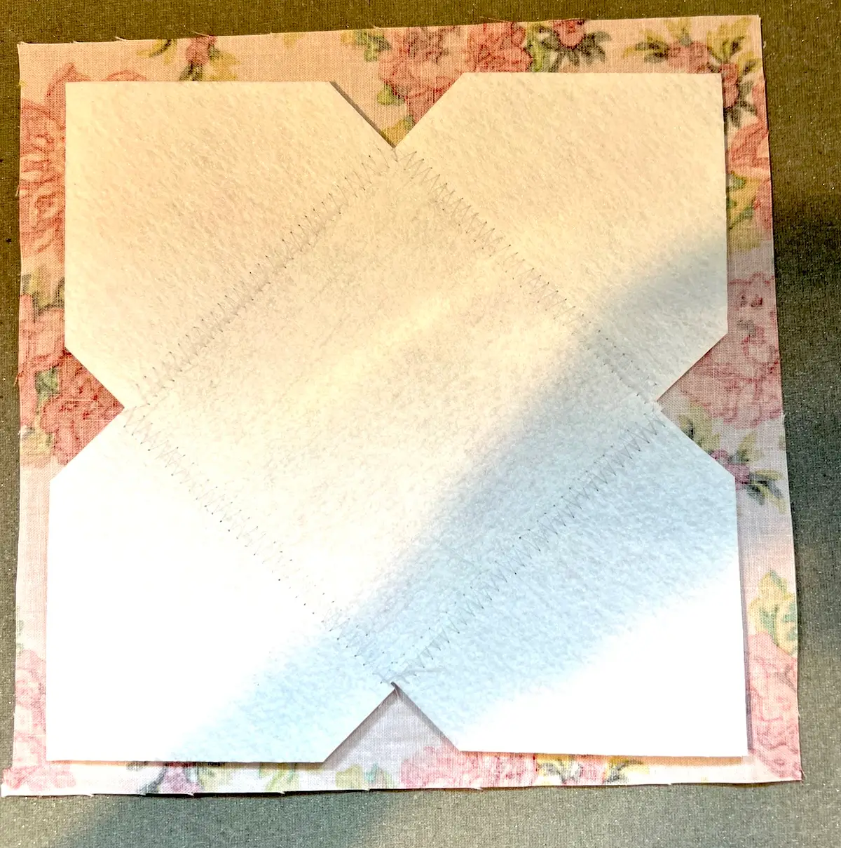 Laying the peltex on the fabric for the box top