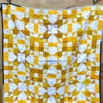 Gold and white quilt made by Krystle Merchant