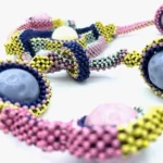 Detail of BabyPods necklace by Maracole Bijoux