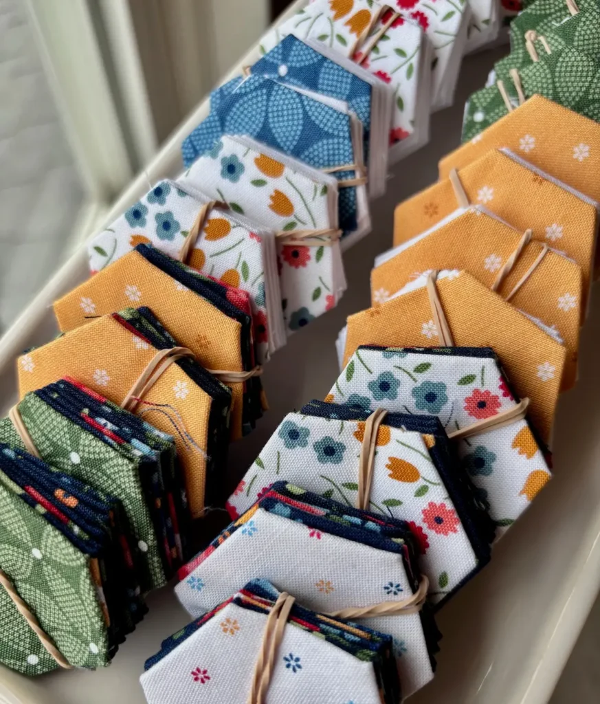 Stacks of hexies for Grandmas Hexie Garden by Marie-Elise McNeeley