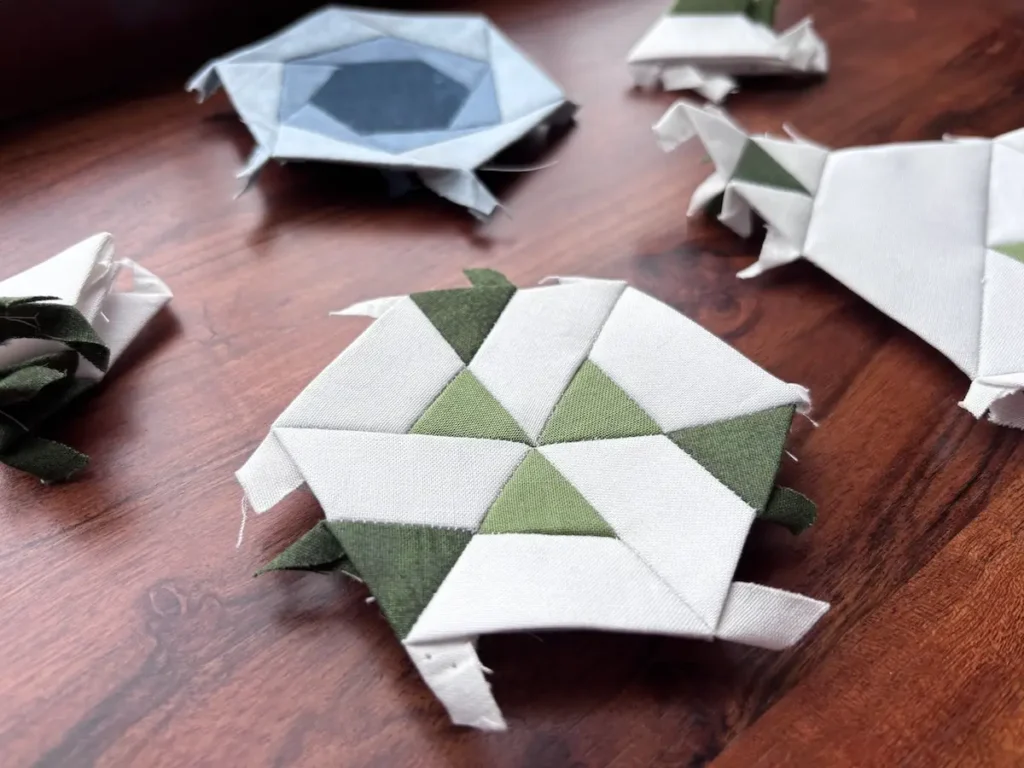 Pieced green units for the Hexies in Bloom by Marie-Elise McNeeley