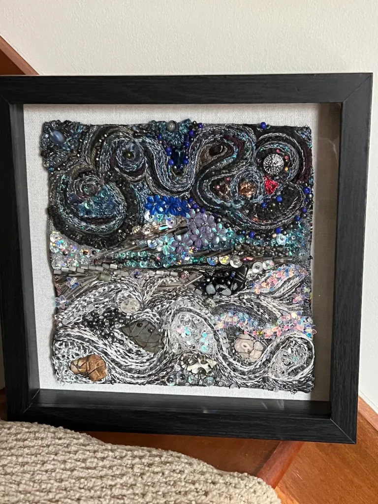 Black, white with other colors beaded and embroidered fiber art by MaryAnne Lupinetti