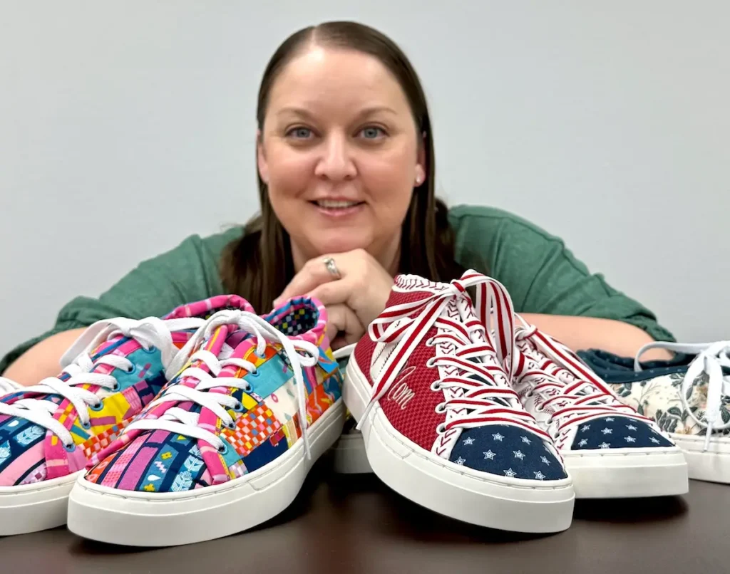 Natalie Buxkemper and a spread of sneakers that she has made