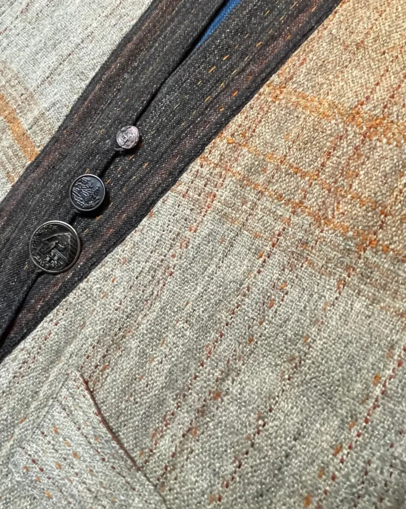 Lichen coat woven by Sara Lamb