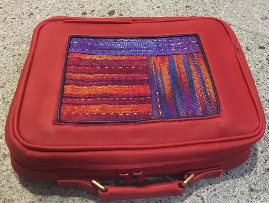 Leather project bag with fabric insert made by Sara Lamb