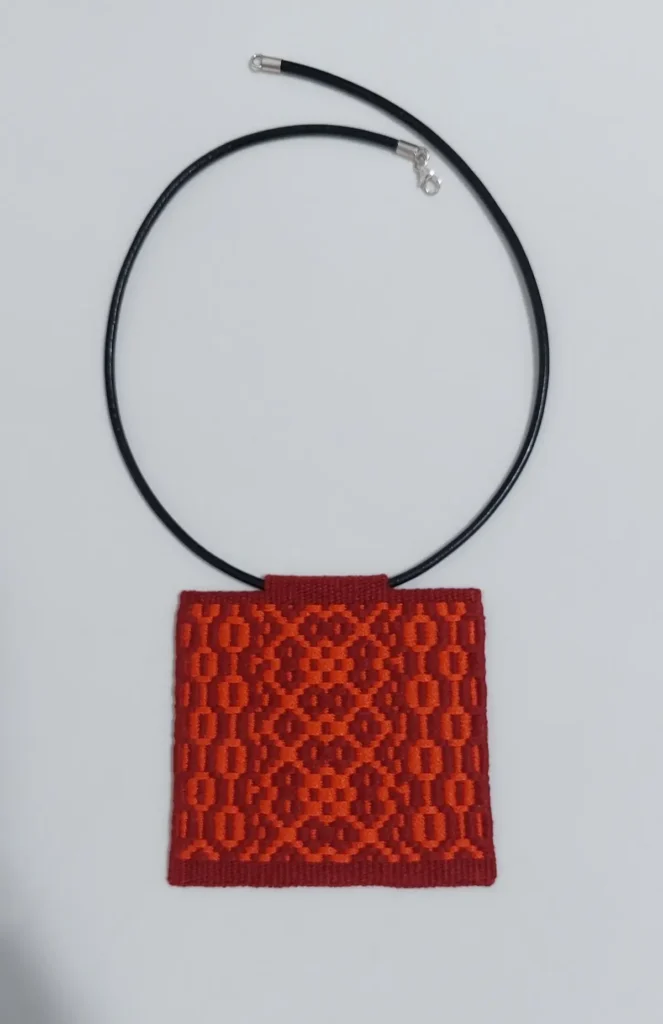 Red woven necklace by Vanina Bujalter
