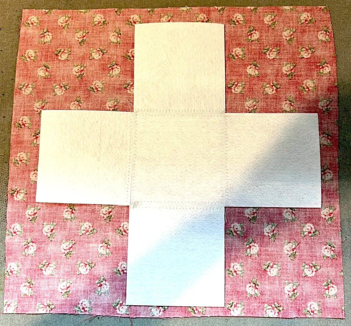 Laying the peltex on the fabric for the box base