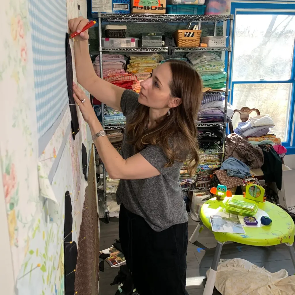 Jessica Wohl working on her design wall in her studio