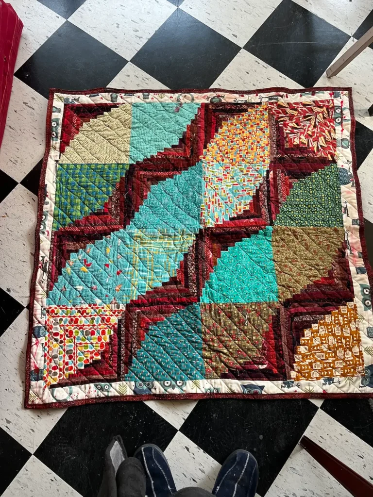 Log cabin quilt by Scot Augustston