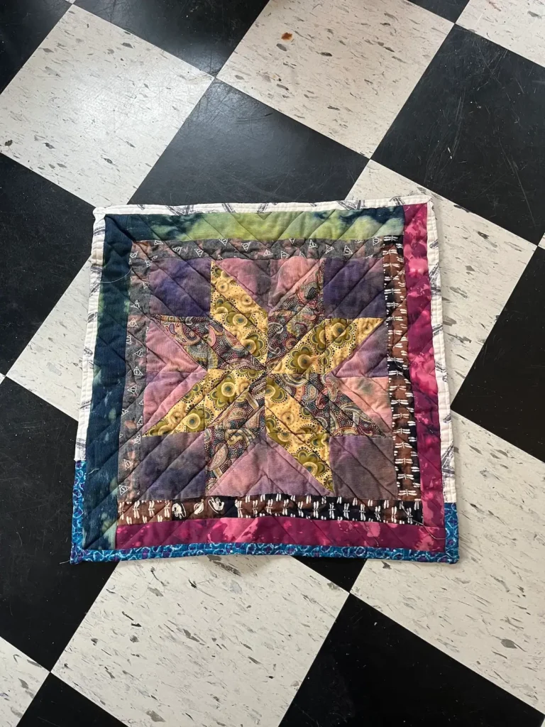 Yellow center star quilt by Scot Augustston